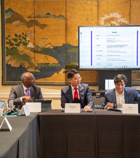 co-hosts sit at the head of the table