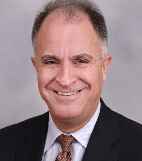 professor david yermack in a black blazer and brown tie