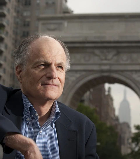 headshot of thomas sargent in a blazer in front of the Washington Square Park arch