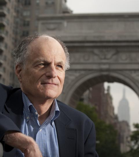 headshot of thomas sargent in a blazer in front of the Washington Square Park arch