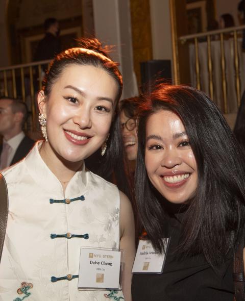 Two alumni pose at the Haskins Award Dinner