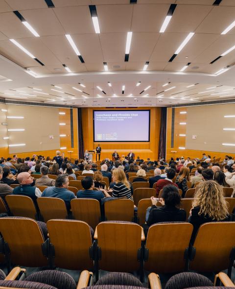 Stern alumni gather at a lecture as part of Reunion 2024
