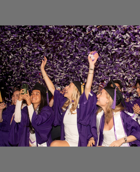 Stern UC students celebrating graduation as confetti falls