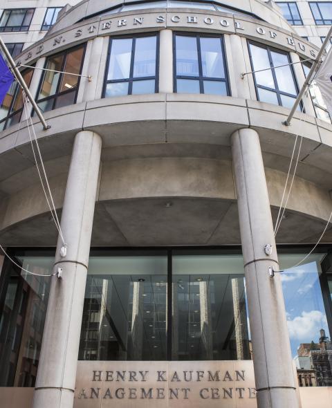 Front of KMC with NYU Flags