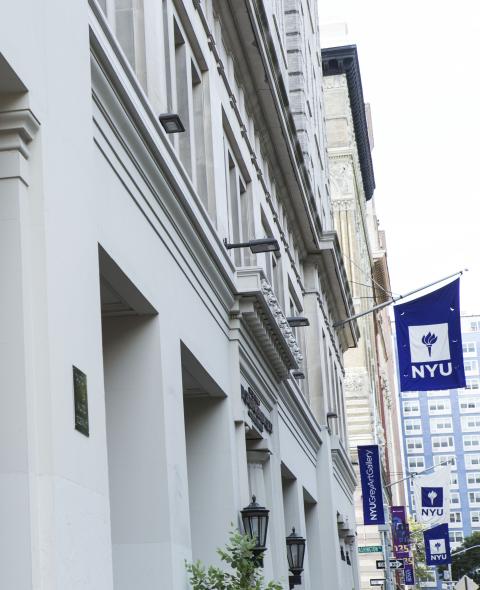 Column of a building and NYU flag