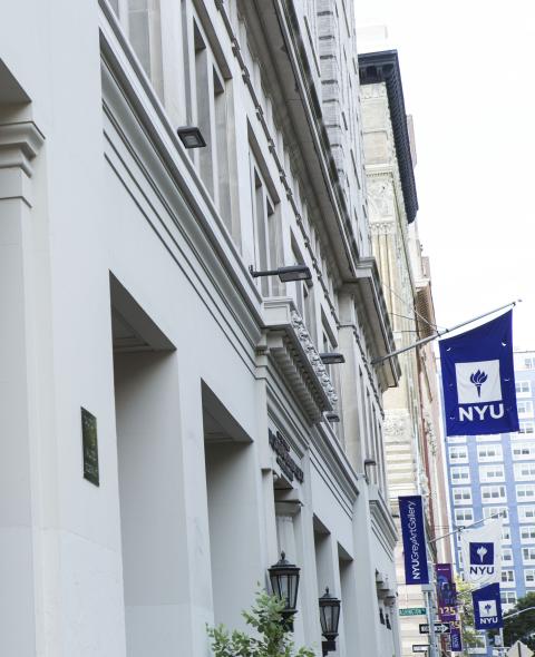 Column of a building and NYU flag Column of a building and NYU flag