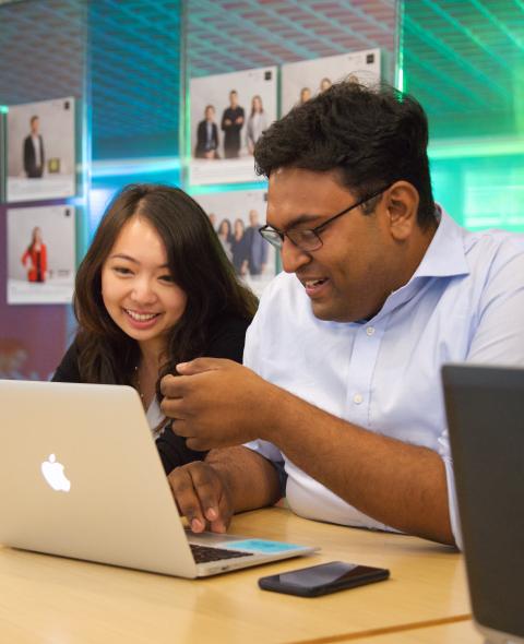 Stern students looking at a computer