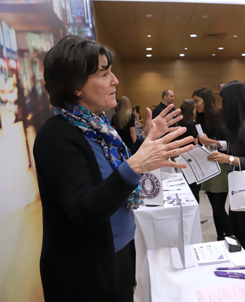 Eliza Shanley speaks with a Langone student at Langone LAB