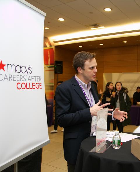 Students chat with with a recruiter from Macy's at an on-campus event