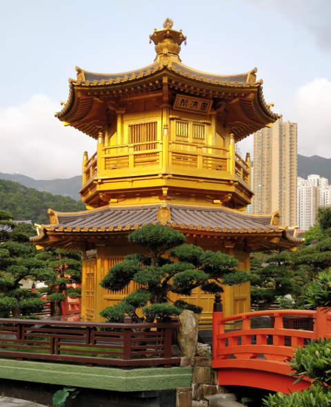 Golden pagoda and garden with red bridge