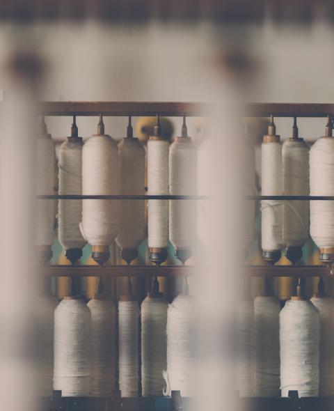 Spools of cotton reels in a manufacturing plant