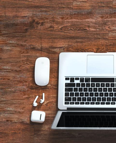 Laptop with airpods on a table