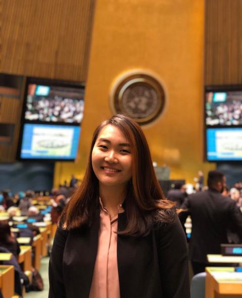 Young woman standing  in UN General Assembly