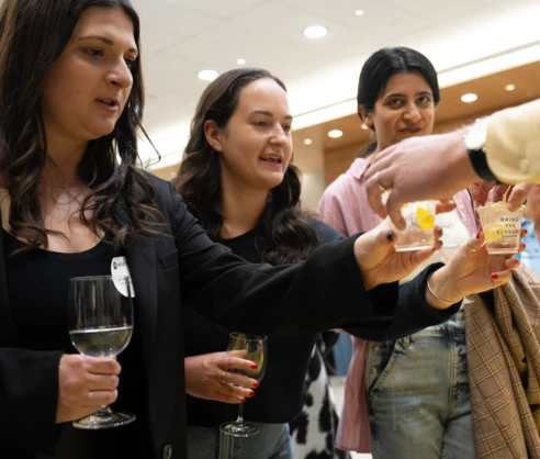 Alumni tasting beverages at Taste of Stern 2024