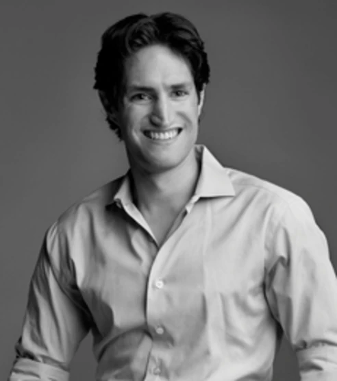 black and white headshot of professor adam alter