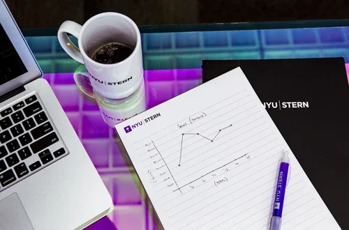 Mug and notepad with laptop