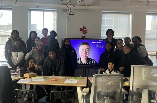 Students around a Zoom Screen w/ Dustin