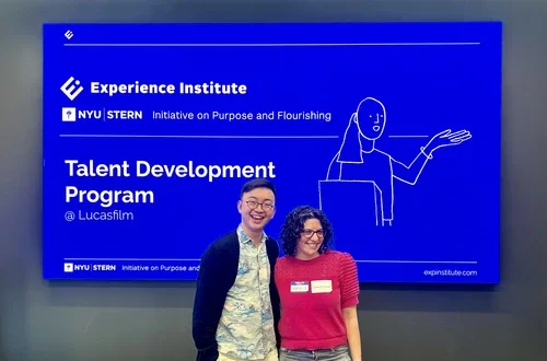 Two people in front of a powerpoint about LucasFilm