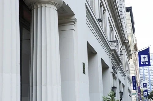 Column of a building and NYU flag