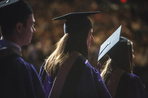 Grads walk across the stage at MSG