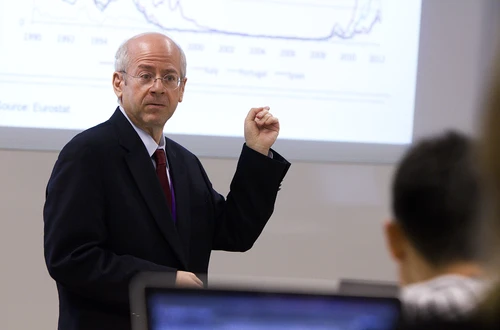 Kim Schoenholtz points at a projection of a graph