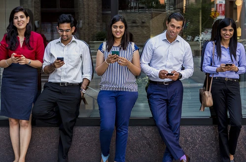 Students on their phones in Gould Plaza