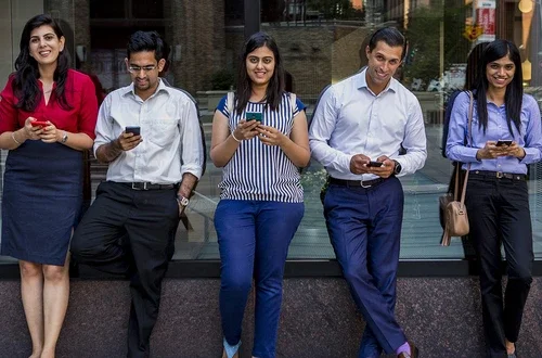 Students on their phones in Gould Plaza