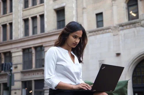 Student using laptop outside