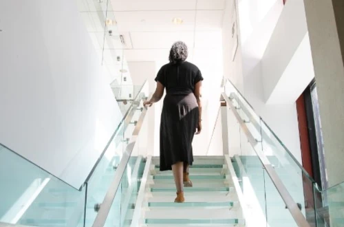 Woman walking up stairs