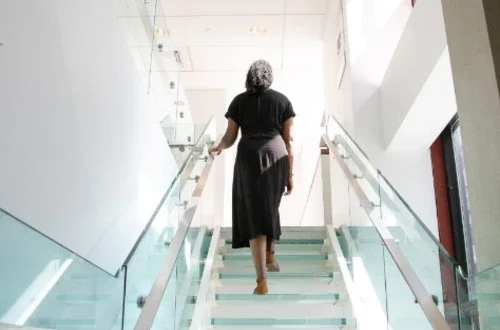 Woman walking up stairs