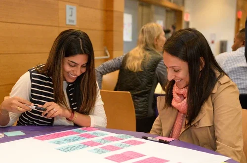 students collaborating at a table