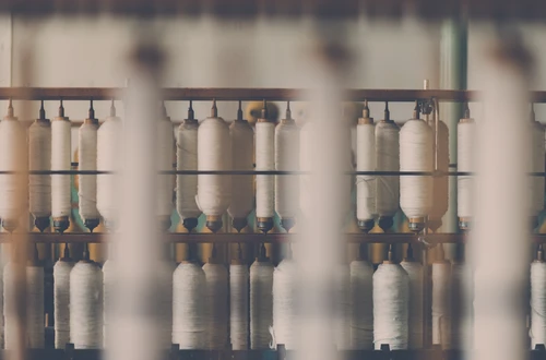 Spools of cotton reels in a manufacturing plant