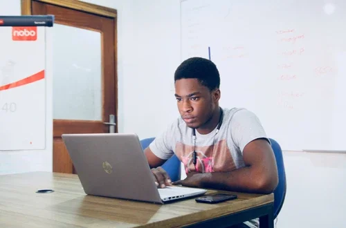 Student watches video on laptop