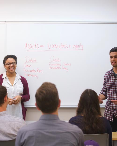 Students give a presentation in a classroom