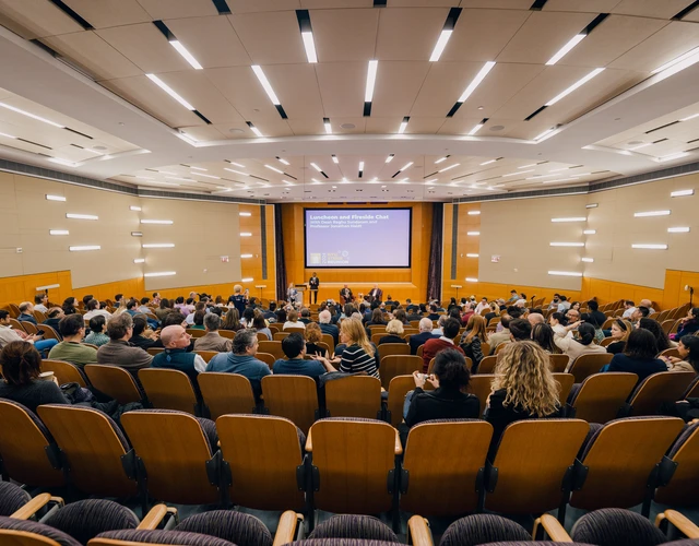 Stern alumni gather at a lecture as part of Reunion 2024