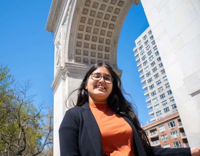 Student under Washington Square Arch