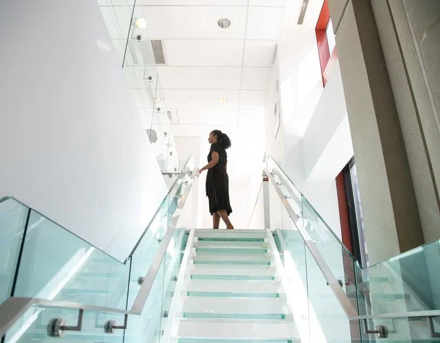 image of woman on top of staircase