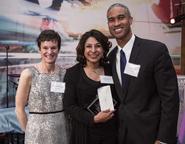Elizabeth Morrison, Dolly Chugh, and Peter Henry at a faculty awards ceremony