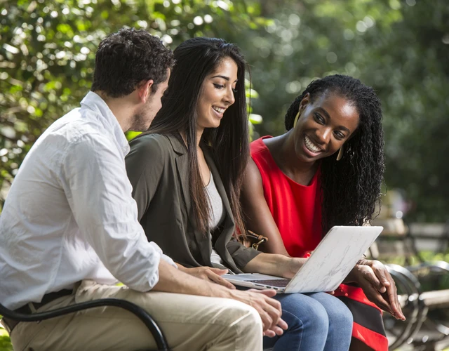 students work together in Washington Square Park