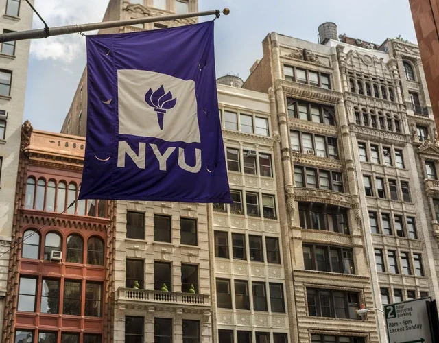 NYU flag against cityscape