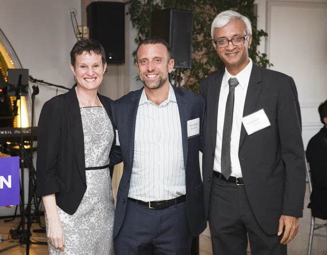 Elizabeth Morrison, Steve Blader, and Raghu Sundaram at faculty awards dinner