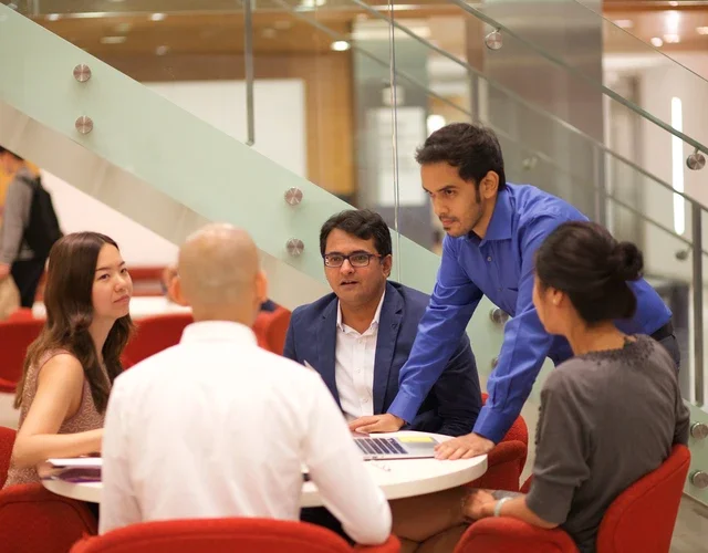Students sitting around a table working