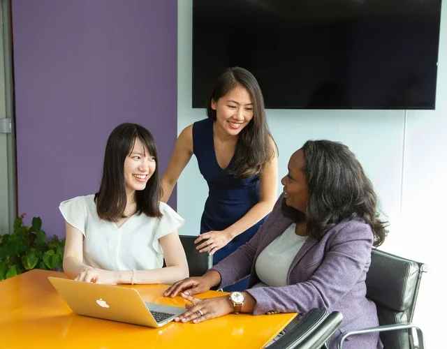 3 women in a conference room