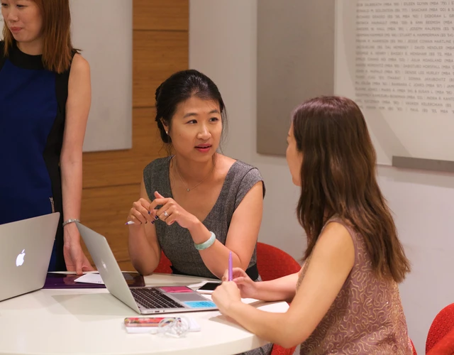 Women working together at a table