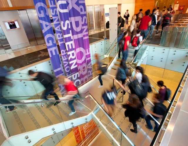Students on the stairs of Tisch