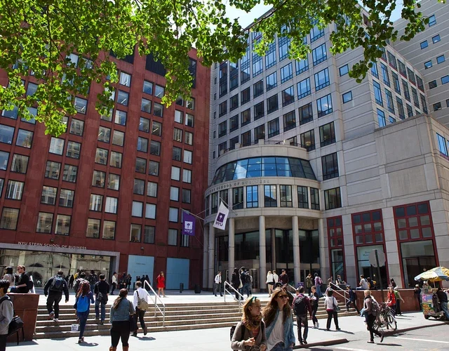 Exterior shot of Stern buildings with people walking on sidewalk