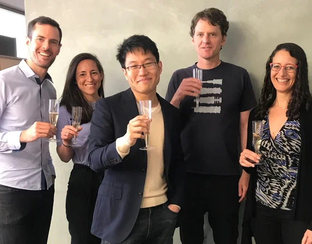 Chris To celebrating successful defense with his dissertation committee