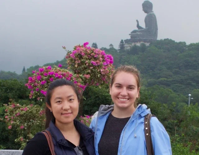 Linda in Hong Kong with the Big Buddha in the background