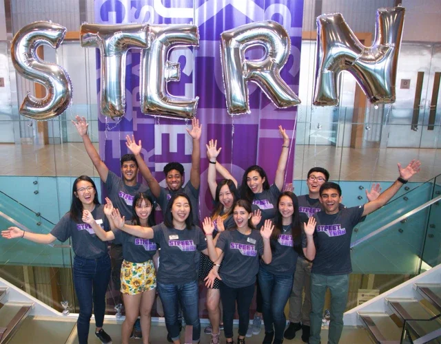 Students cheering in stairwell