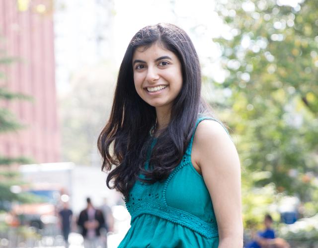 Shivangi Khanna sitting in Washington Square Park